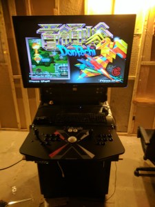 80% done, displaying a random game on the cabinet